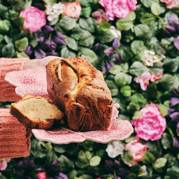 banana bread on a plate with roses in the background_recipe book 2021