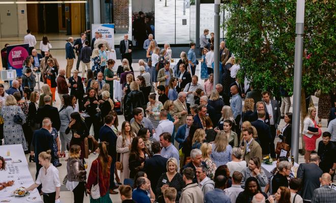 crowd of people networking at an event