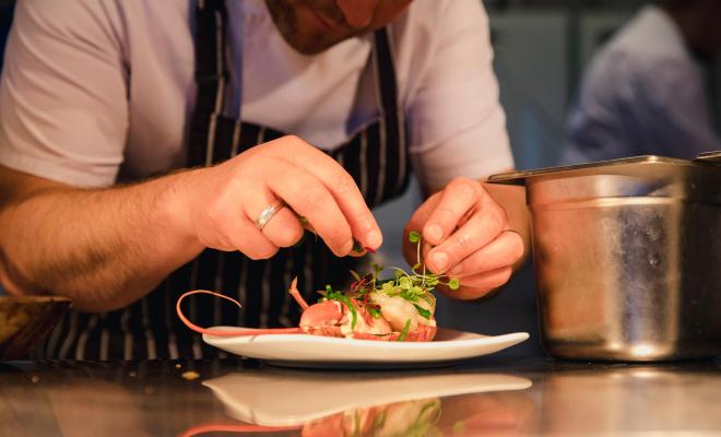 Professional Chef preparing food at the pass