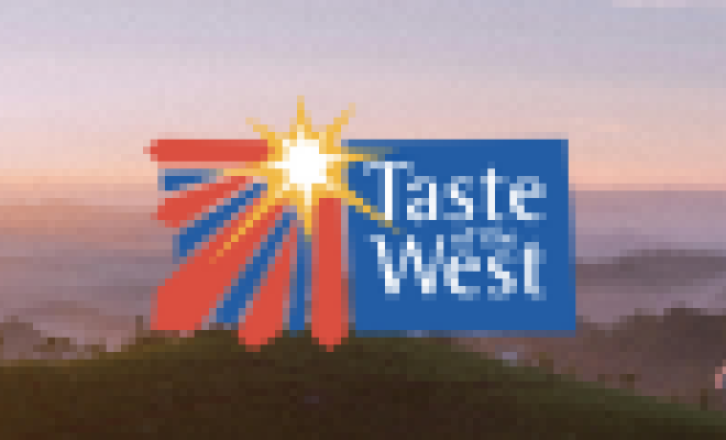 taste of the west logo over an image of a sunrise