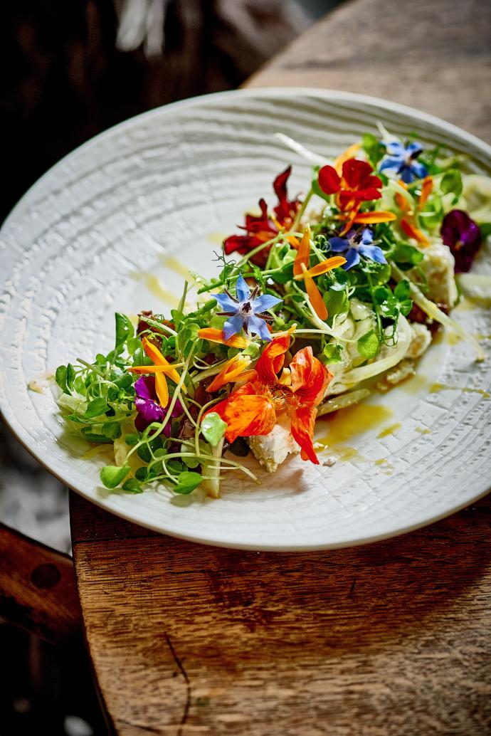 plate of food decorated with edible flowers